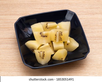 Gold Kiwifruit Cut And Served On A Plate.