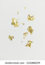 Gold Leaf Scrap On A White Background.