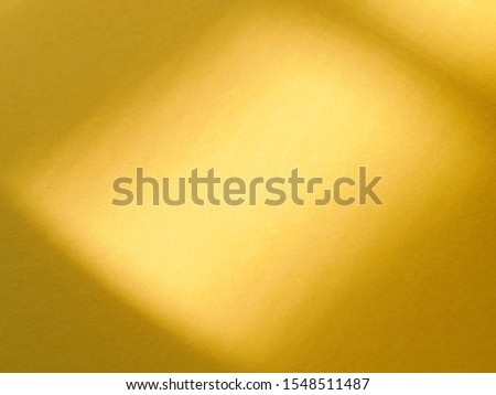 gold or ligh brown gradient color. Use  for background. the color pattern from light to dark golden brown. The photo of brown paper with sunlight on 