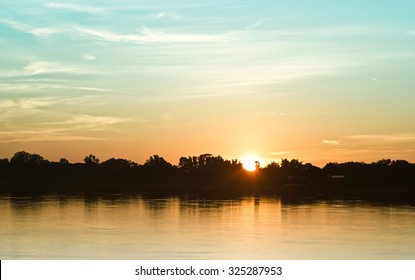 Gold Light On Sun Set With Light On The River.Idyllic Wallpaper Setting Sun.