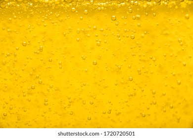 Gold  Liquid Bubble Background With Bubbles. Beer Or Vegetable Oil Background