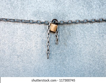Gold lock chain fastens metal industrial box