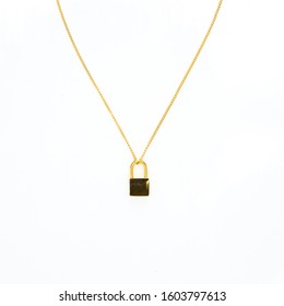 Gold Lock Necklace On White Background