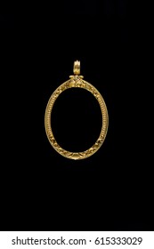 gold locket frame pendant on black background
