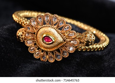 Gold looking bangles jewellery close up image  