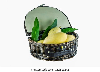 gold mangoes in  weaving basket ,thai fruit isolated on a white background