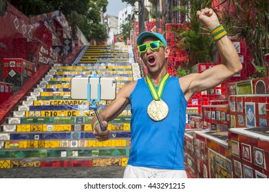 Gold Medal Athlete Taking A Fist Pump Selfie In Front Of The Colorful Selaron Steps In Rio De Janeiro, Brazil