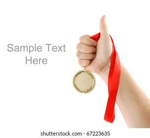 Gold Medal In Hand Isolated On White