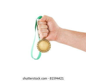 Gold Medal In Hand Isolated On White