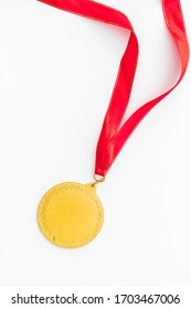 Gold Medal With Red Ribbon - Winner, Success Concept - On White Background Top View