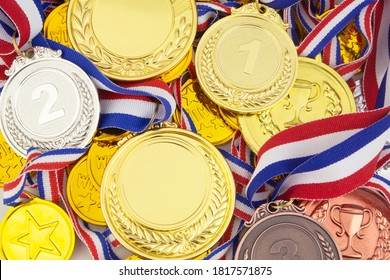 A Lot Of Gold Medals With Ribbons Background