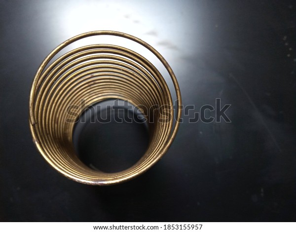 gold metal circle with\
dark background