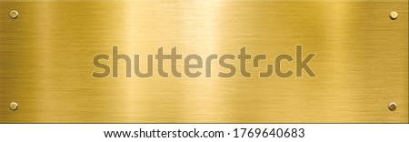 gold metal plaque or nameboard with rivets background