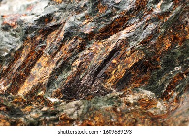 Gold Mine. Rock With Gold Veins On Its Surface. Selective Focus.