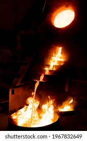 Gold Mining Industry. Hot Melted Metal Pouring In Forms For Gold Ingot. Fire Flames On Aurum Moulding Process. Metallurgy Technology. Golden Bar Making Process. Pure Gold. Real Value For Business