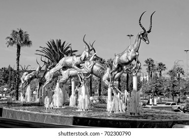 Gold. Mining Industry Of South Africa. Amazing Golden Springboks Jump In A Fountain. Black And White Photography. Johannesburg Gold Reef City. South Africa - December 21, 2013 