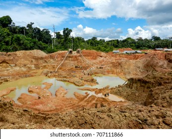 Gold Mining Place In Guyana, Local Indigenous People Clear Workspace From Stones And Check It For Gold Nuggets. Amazon And Essequibo Basin Deforestation. Guyana, Brazil, Venezuela Gold Mining Deforestation.