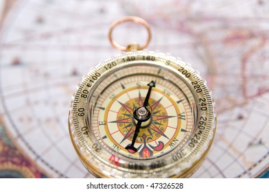 Gold modern compass and old map - Shutterstock ID 47326528