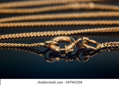 Gold Necklace Chain Clasp Or Closure Closed On Reflecting Glass Table