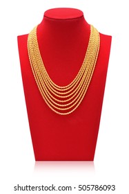 Gold Necklace On Necklace Display Stand. Red Mannequin.