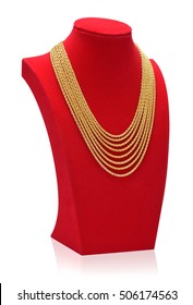 Gold Necklace On Necklace Display Stand. Red Mannequin.