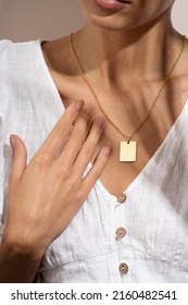 Gold necklace female lady wearing white collar clothes  Close  up young woman in white shirt wearing golden necklaces  Modern fashion details  Minimalist lifestyle