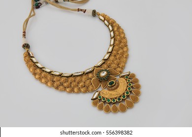 Gold Necklace on a white background.