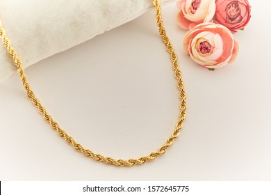 Gold Necklace With Rose Background