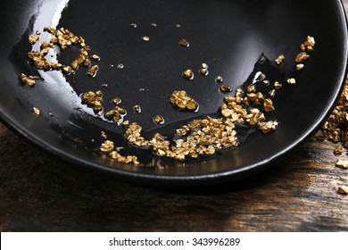 Gold Nugget Grains, On Black Plate, Close-up