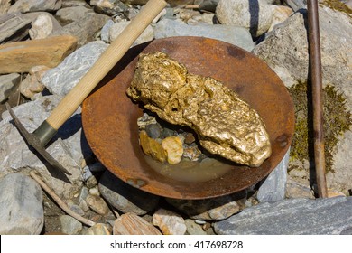 Gold Nugget Mining From The River, With A Gold Pan, And Find Some Big Gold Nugget.