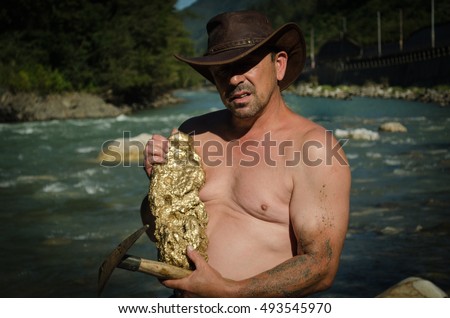 Gold Nugget mining from the River, with a gold pan, and find some big gold nugget.