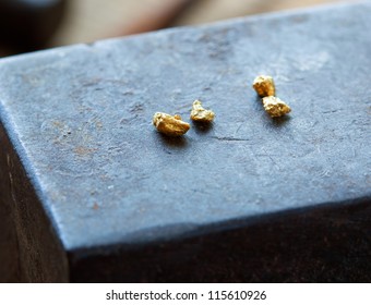 Gold Nuggets On A Old Anvil.