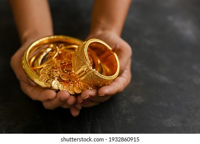 Gold ornaments women hand holding traditional jewelry in Kerala India. Kerala Indian Christian girl wearing gold jewellery old fashion. Ethnic ornaments of ancient Christian Woman.