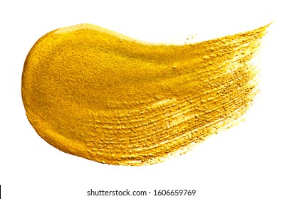 Gold paint Brush stroke isolated on white background. Flowing abstract Gold metallic paint smudge close-up. Smear of glittering make-up Lipgloss, blot of nail polish closeup, macro texture