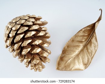 Gold Pinecone And Gold Leaf. Christmas Decoration. Isolated On White Background