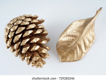 Gold Pinecone And Gold Leaf. Christmas Decoration. Isolated On White Background