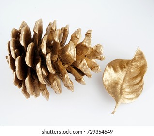 Gold Pinecone And Gold Leaf. Christmas Decoration. Isolated On White Background