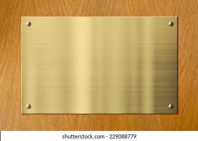 Gold Plaque On Wood Background