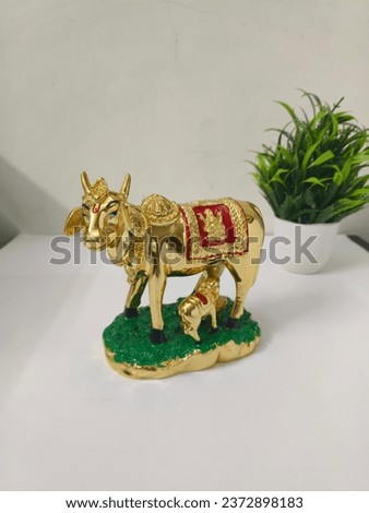 Gold plated kamdhenu cow with calf