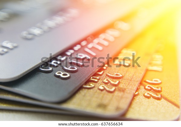 Gold and platinum\
credit cards close up