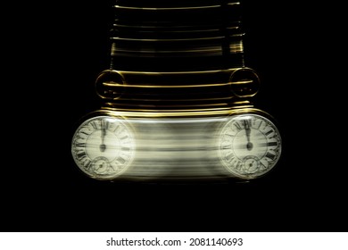 Gold Pocket watch swinging hypnotically from chain. Black background