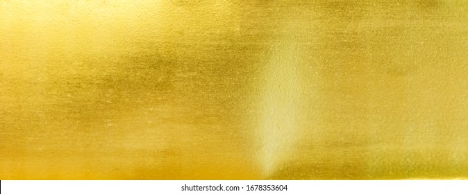 goldpolierter Metallstruktur abstrakter Hintergrund.