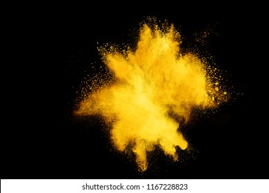 Gold powder particles explosion. Glitter burst with golden texture. Golden color dust splash for fashion background, luxury wallpaper. Magic mist glowing. Powdered vivid gold on black background.
