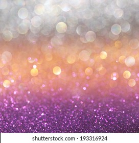 Gold And Purple Abstract Bokeh Lights. Defocused Background 