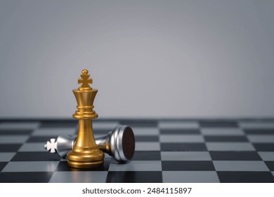 Gold queen chess piece standing victorious over fallen silver king piece on chessboard. Concept of strategy, victory, and leadership. - Powered by Shutterstock