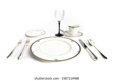 A Gold Rimmed Fine China Place Setting An Elegant Dinner Isolated On White