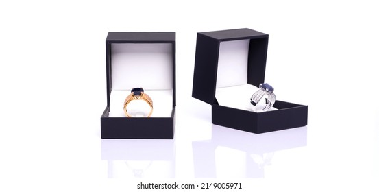 Gold Ring With Blue Sapphire And Diamond In Dark Blue Jewel Box. The Platinum Ring Was Placed Next To It. Collection Of Natural Gemstones Accessories. Studio Shot