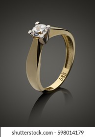 Gold Ring With Diamond On A Dark Background