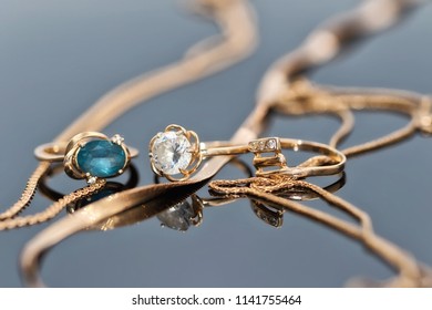 Gold Ring With Light Topaz And A Thick Ring With Small Diamonds