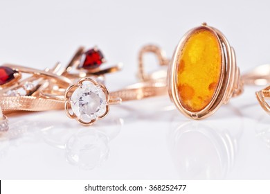 Gold rings of different shapes with diamonds and amber